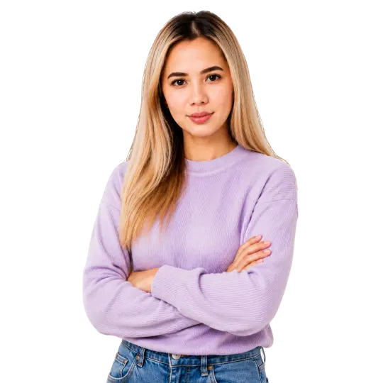 Professional woman with long blonde hair wearing a lavender sweater and jeans, standing with her arms crossed on a transparent background.